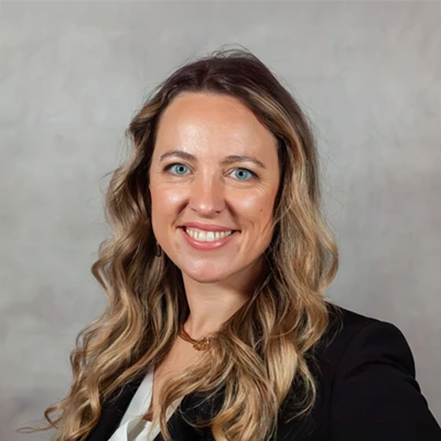 A headshot photo of director of business operations Elisha Catts of Rhodes Chiropractic