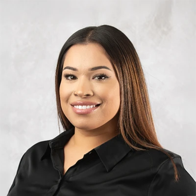 A headshot photo of office Manager Lizette Rodriguez Gamez of Rhodes Chiropractic