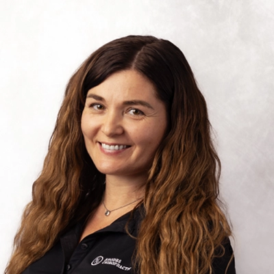 A headshot photo of chiropractic assistant Ruslana Popov of Rhodes Chiropractic
