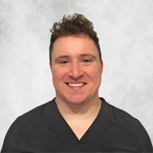 A headshot photo of massage therapist Sean Dunn of Rhodes Chiropractic