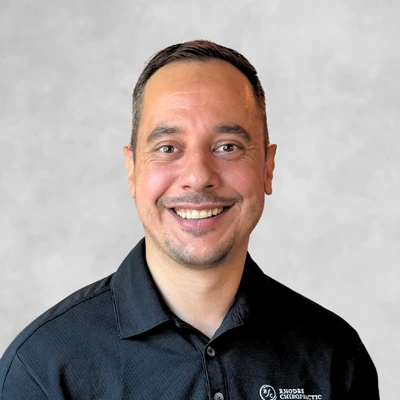 A headshot photo of massage therapist David Smowton of Rhodes Chiropractic