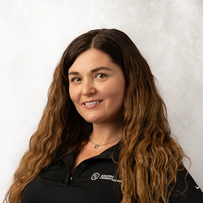 Ruslana smiling in a black shirt.