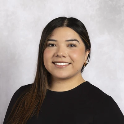 Yoselin smiling in a black shirt.
