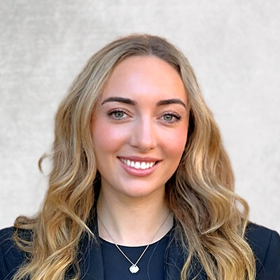Kassidy smiling in a black shirt.